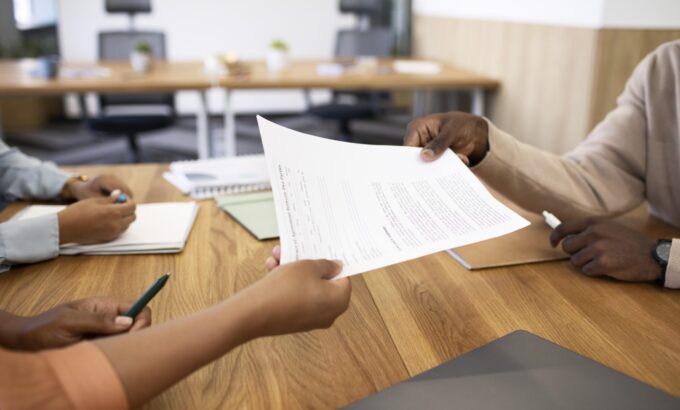 man-holding-contract-his-new-office-job-after-interview